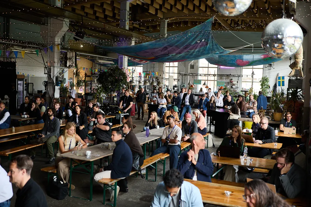 The main hall at Lokstallarna, full of attendees at long tables